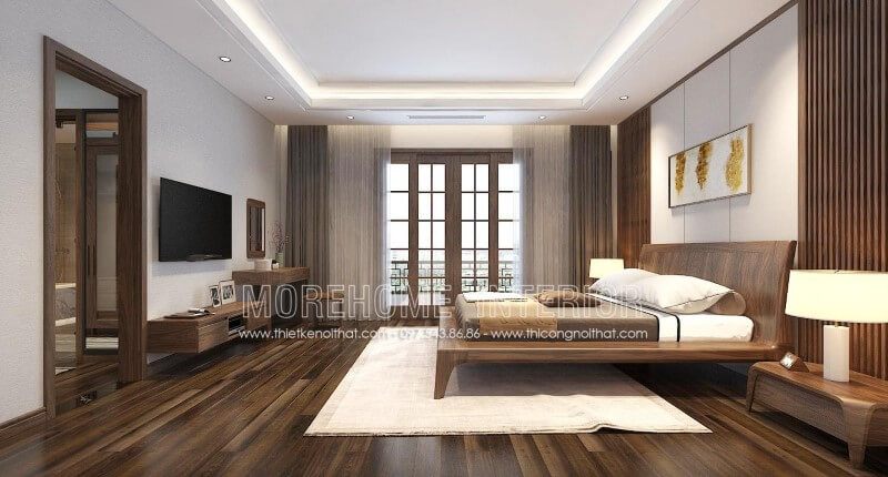 Mẫu kệ tivi gỗ óc chó có kiểu dáng hiện đại và đơn giản, làm nên sự đẹp mắt trong không gian nội thất phòng ngủ của biệt thự An Hưng Hà Đông, Hà Nội.